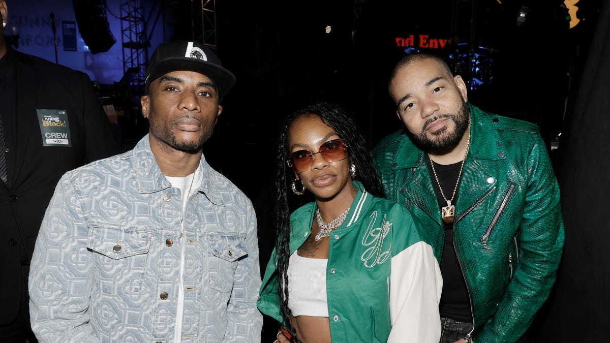 Charlamagne Tha God, Jess Hilarious and DJ Envy pose for a photo