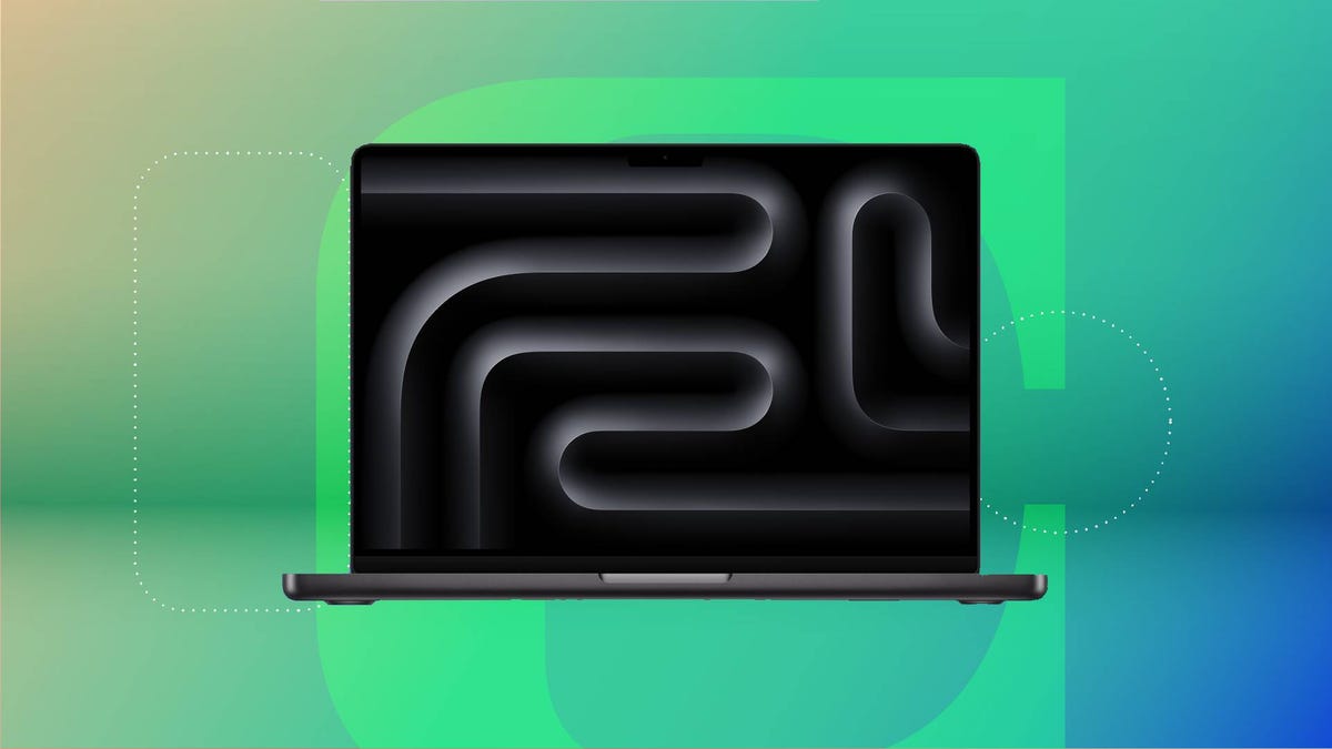 A black laptop against a green gradient CNET background.