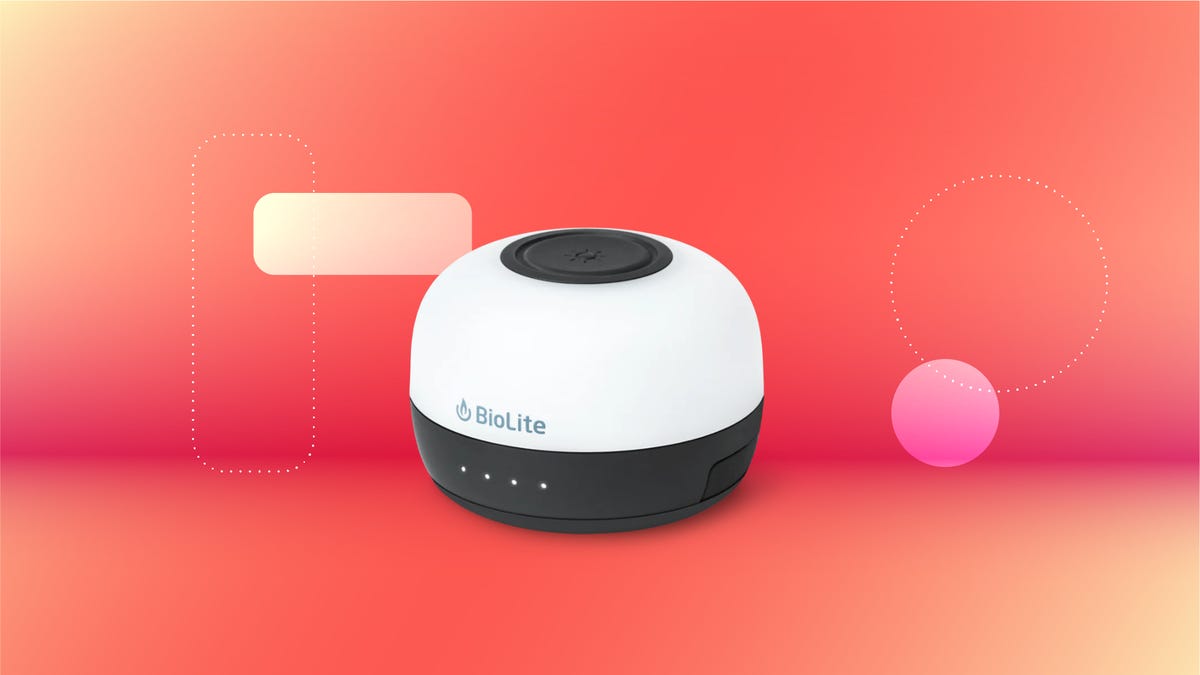 A round, black and white lantern set against a red background