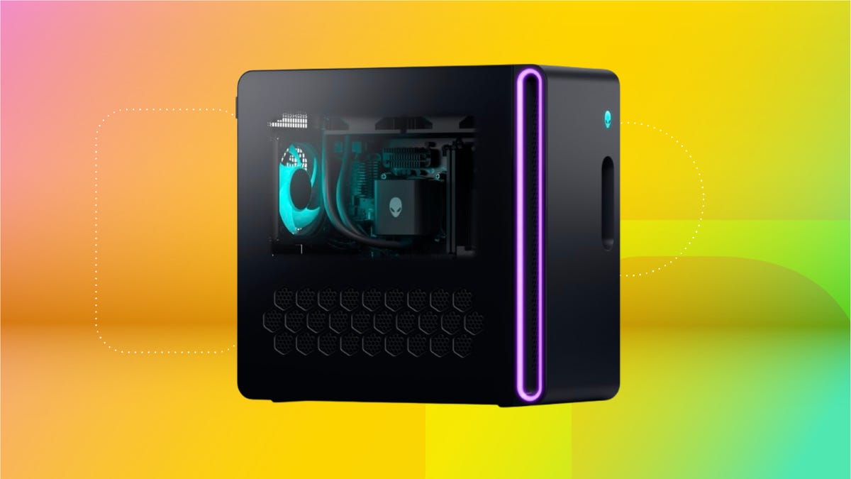 Black desktop with clear door and cyan/purple lights against coral, yellow and mint green CNET background.