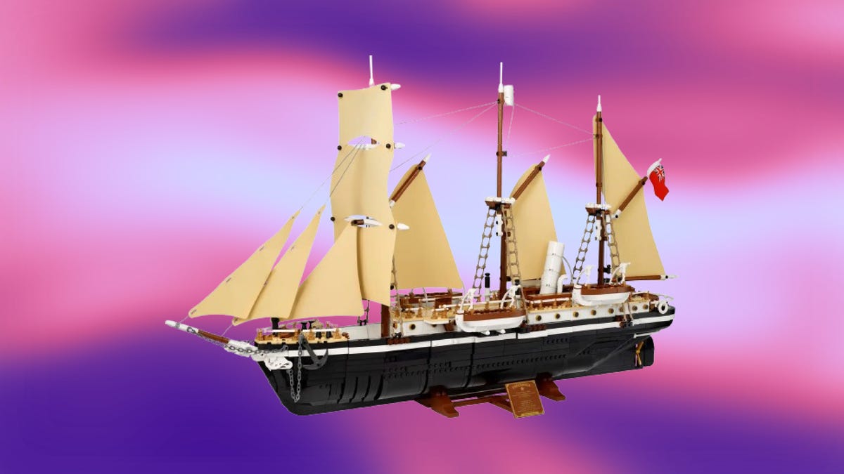 A Lego ship set against a pink and purple background
