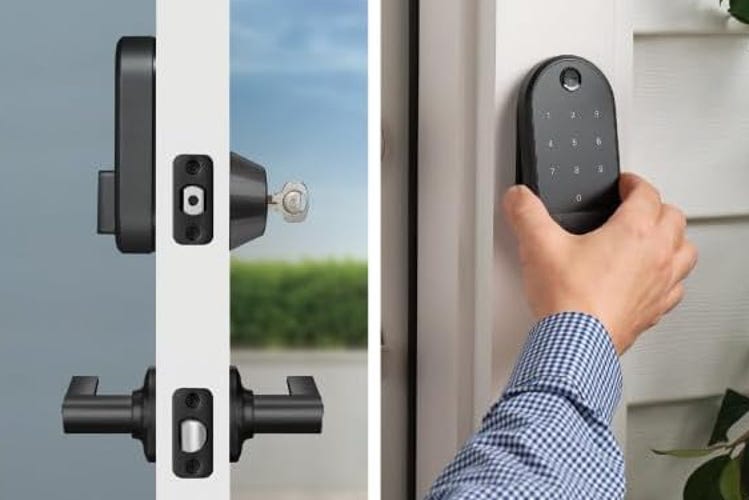Yale's Approach lock on a white door and shown with a hand mounting a keypad.