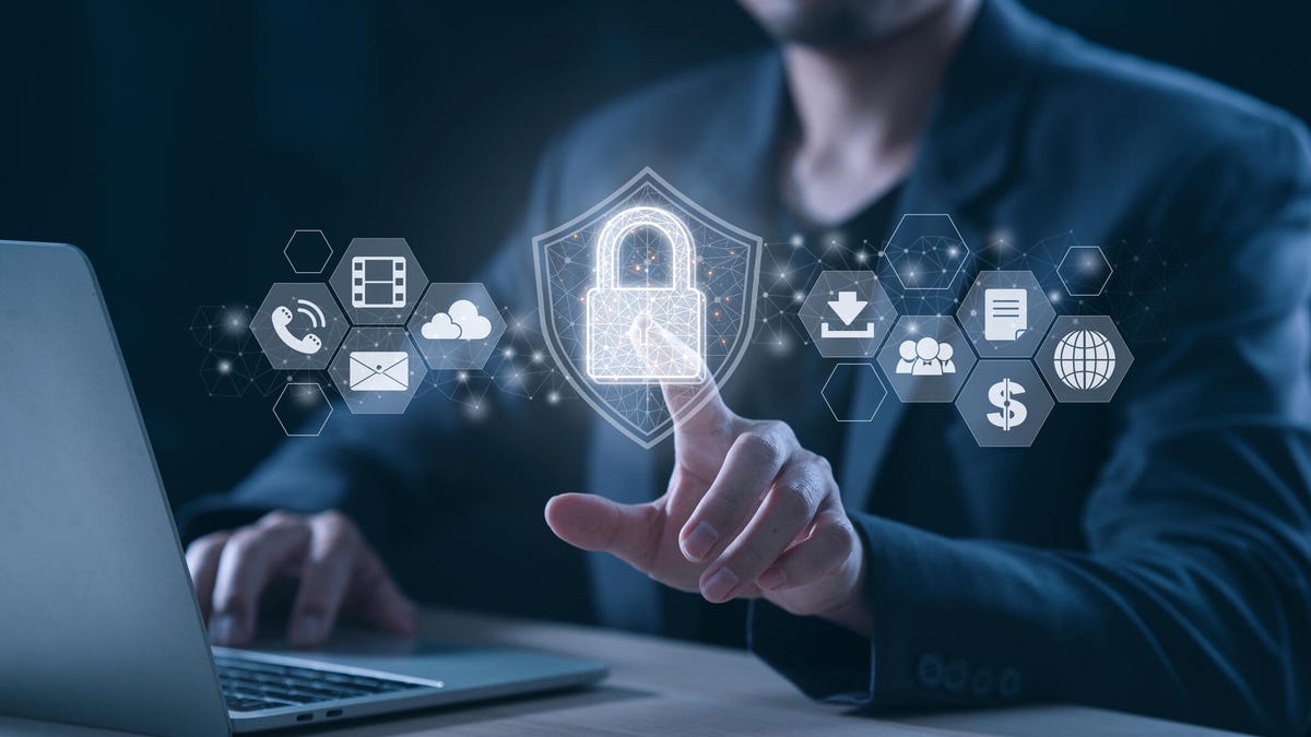 Businessman and labtop using fingerprint identification to access personal financial data for business.