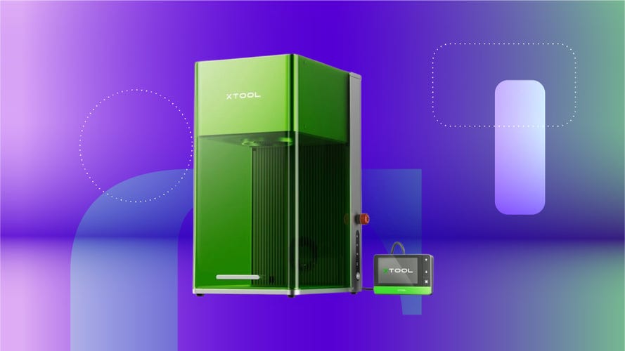 A green laser cutter on a purple neon background