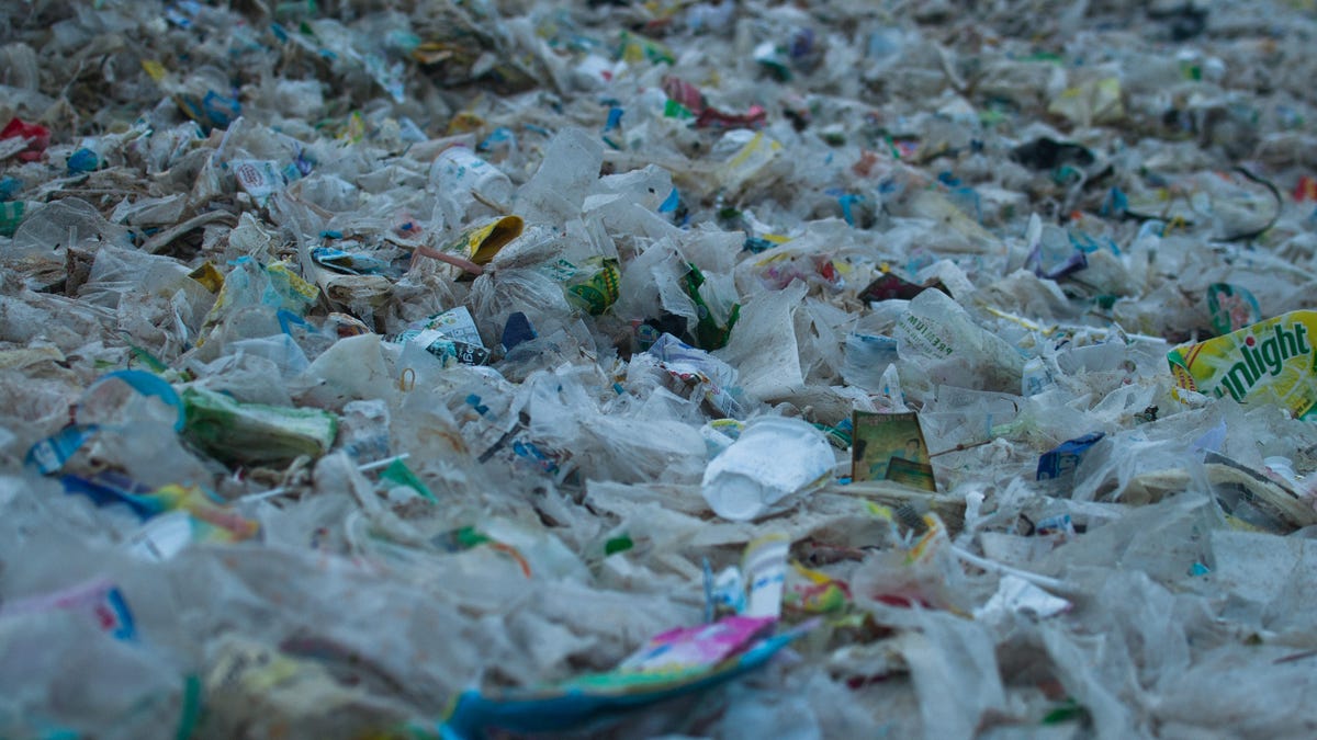 Sand covered garbage in Bali