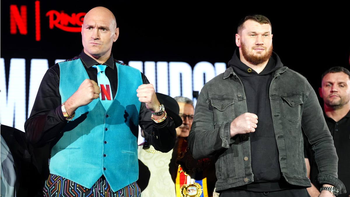 Boxers Tyson Fury (left) and Arslanbek Makhmudov face off during a press conference.
