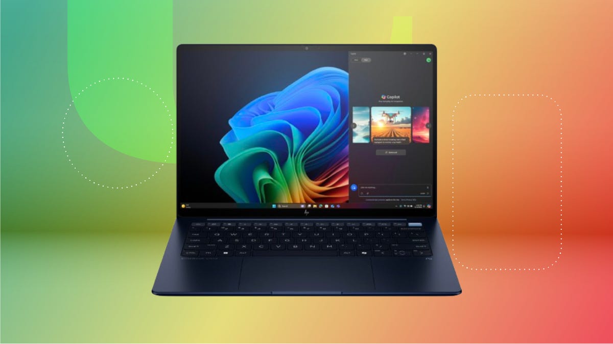 Black HP laptop against green, yellow and red-orange CNET background.