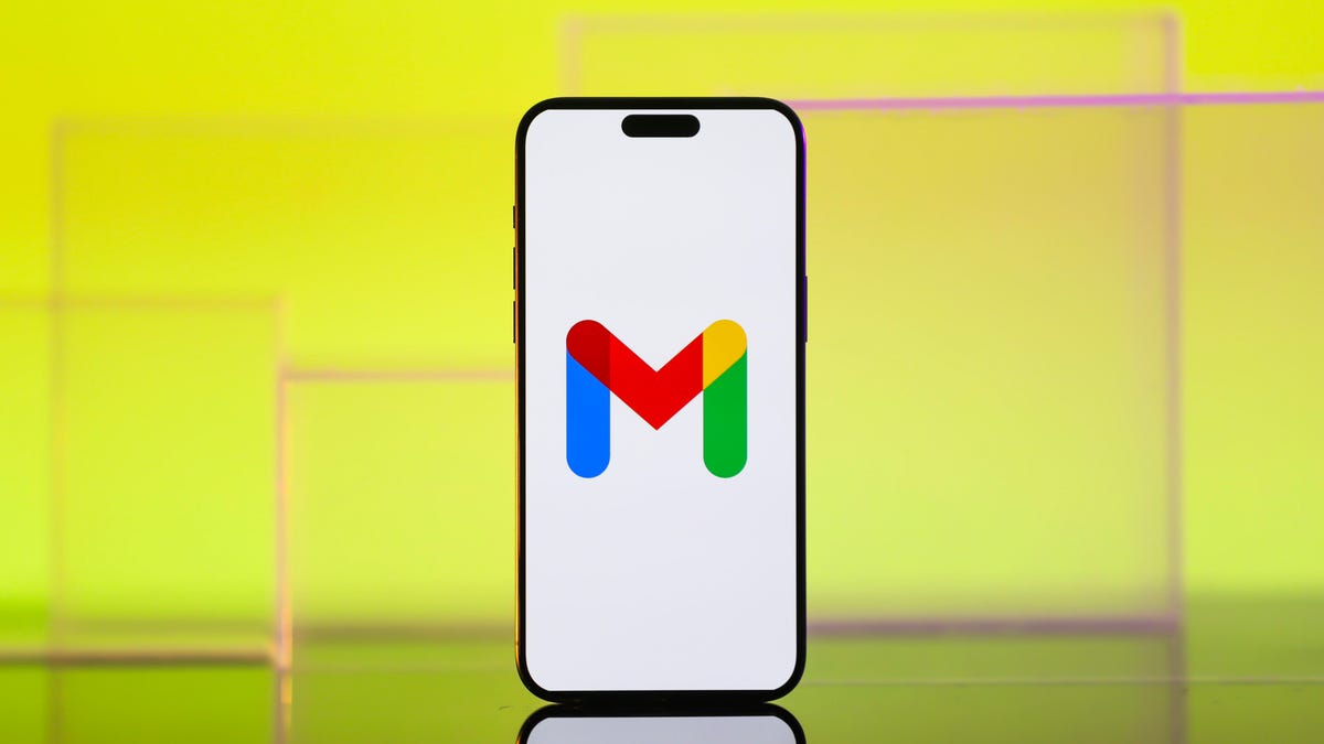 The Google Gmail logo is centered on a mobile phone screen.