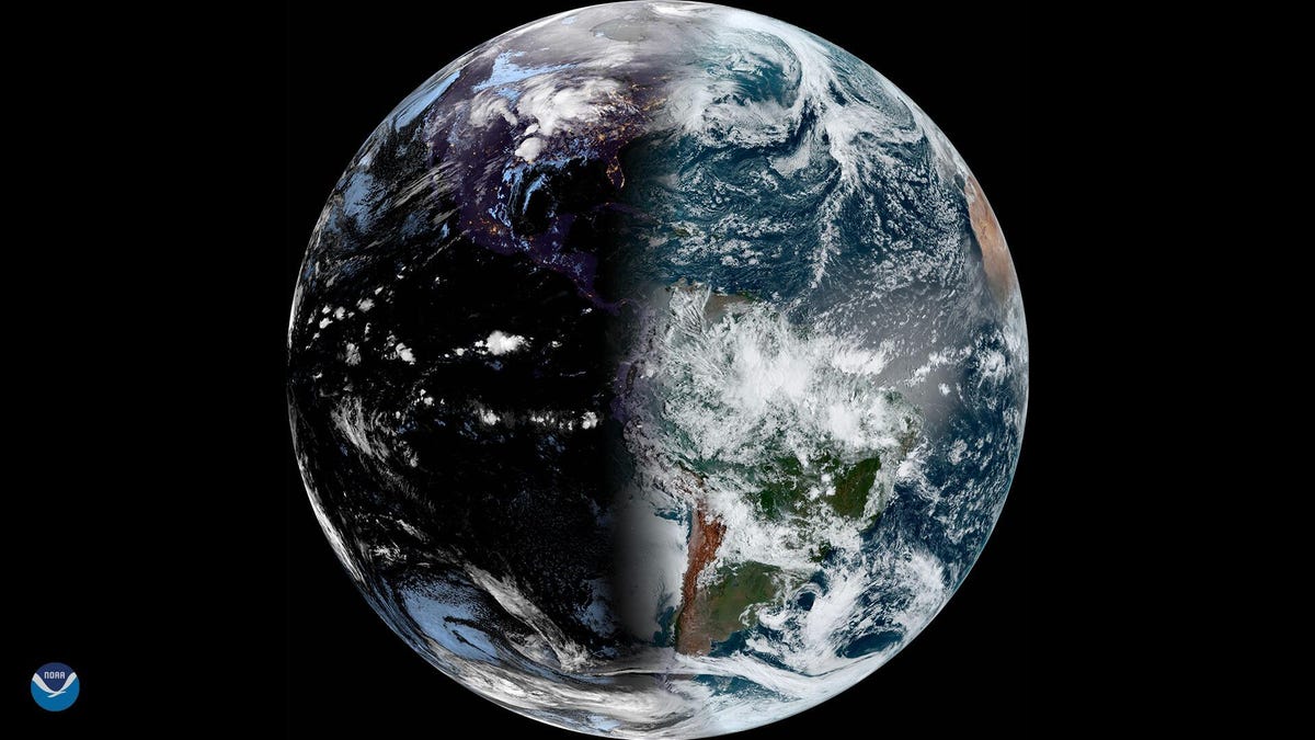 Satellite view of Earth during vernal equinox showing planet half shadowed.