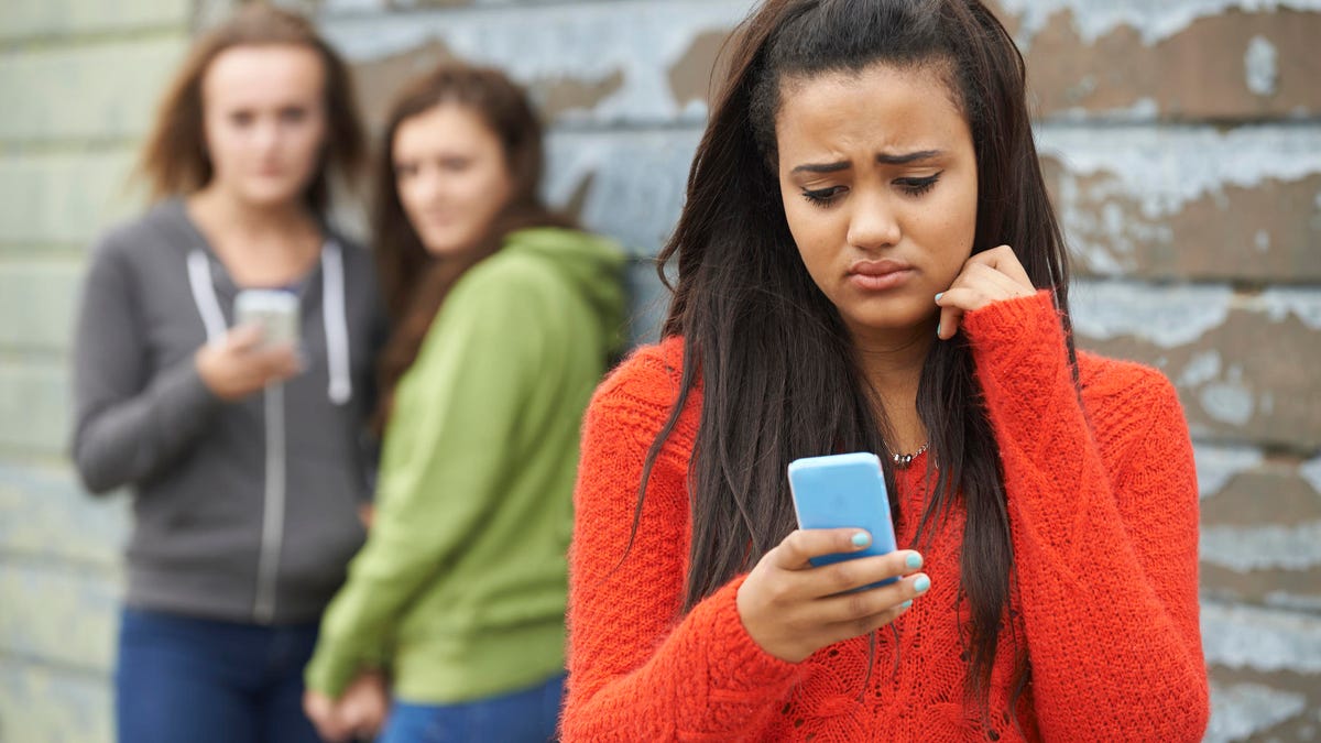 Teenage Girl Being Bullied By Text Message