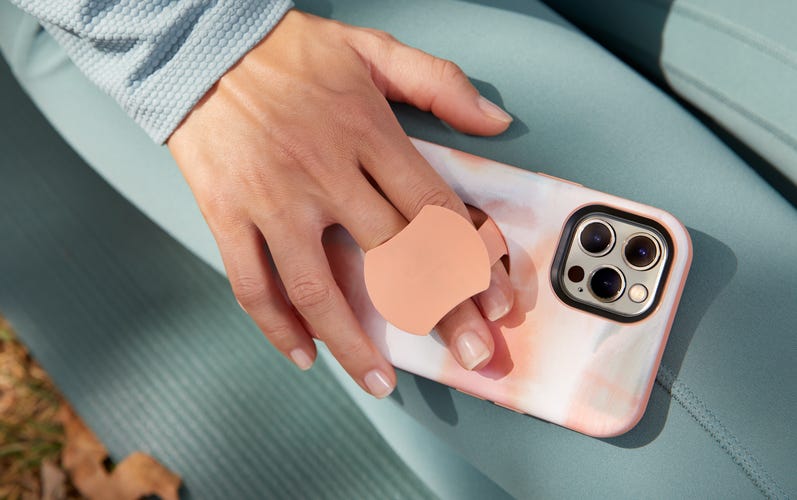 The Otterbox OtterGrip integrates a retractable grip into a Symmetry Series case