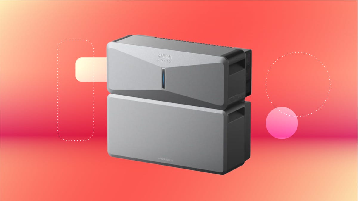 Steel gray Anker Solix whole-home power station against red orange CNET background.