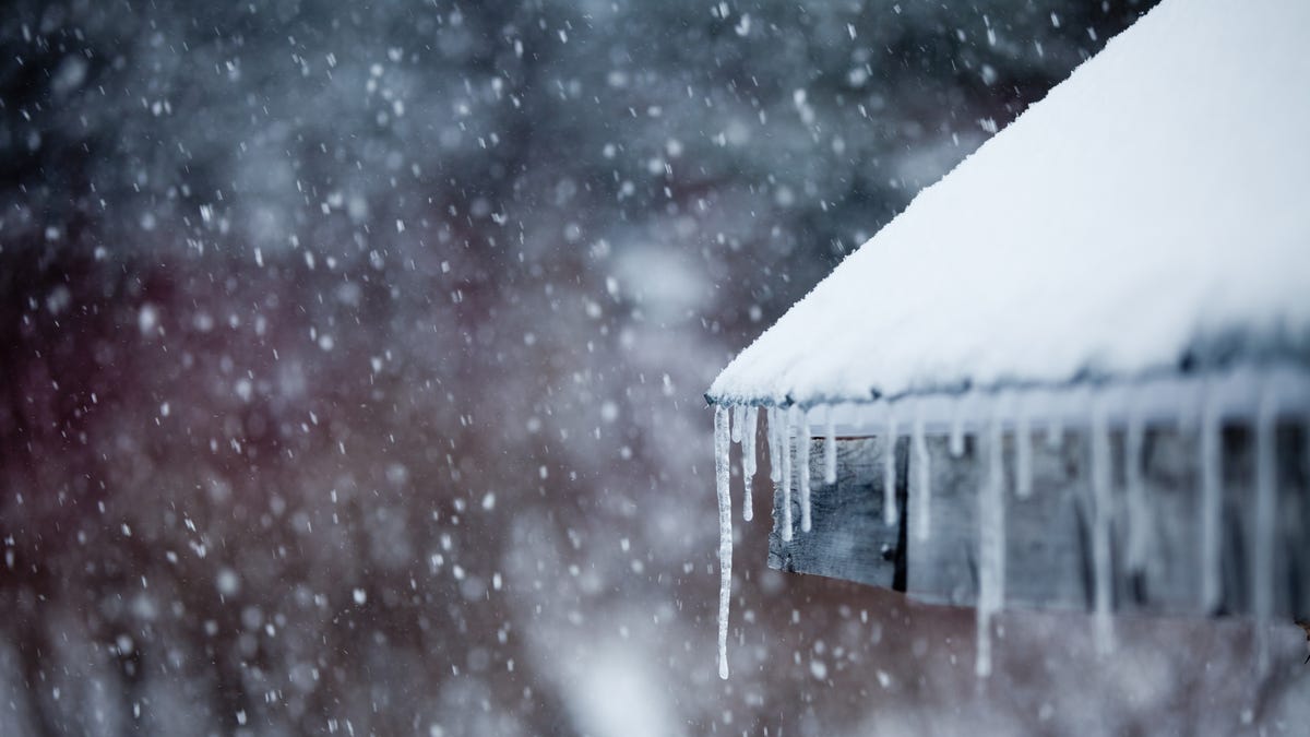 Wintry gutters with icicles forming