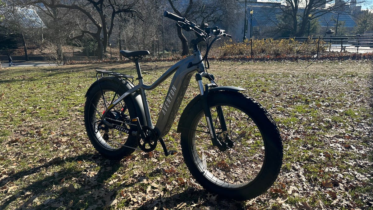 Aventon Aventure 2 bike standing on a muddy field in the sun