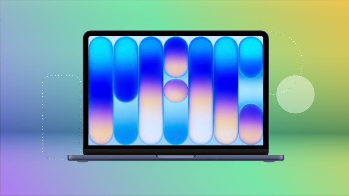 Black Apple Macbook Neo against purple, blue, green and yellow CNET background.