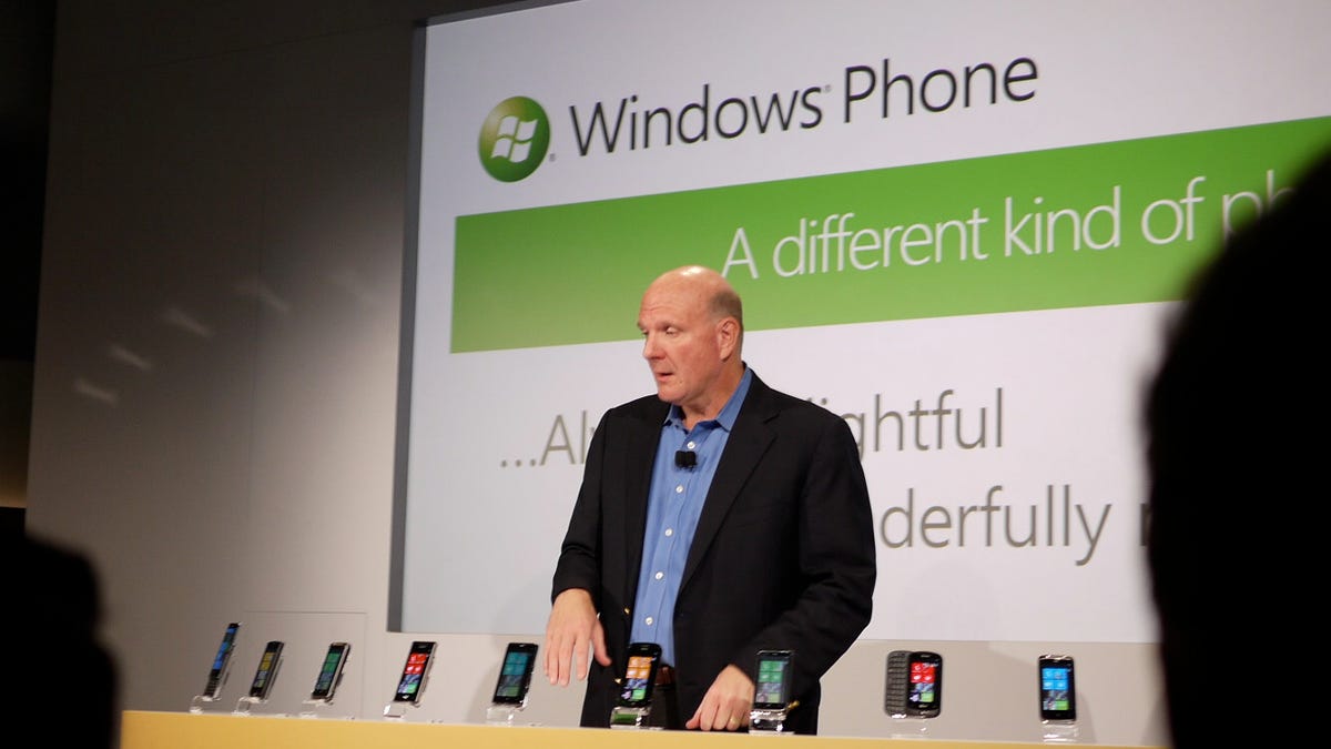 Microsoft CEO Steve Ballmer and Windows Phone 7 handsets