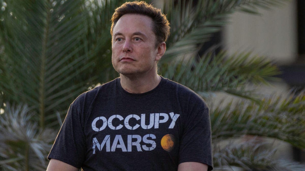 Elon Musk wearing a black T-shirt with the words "Occupy Mars"