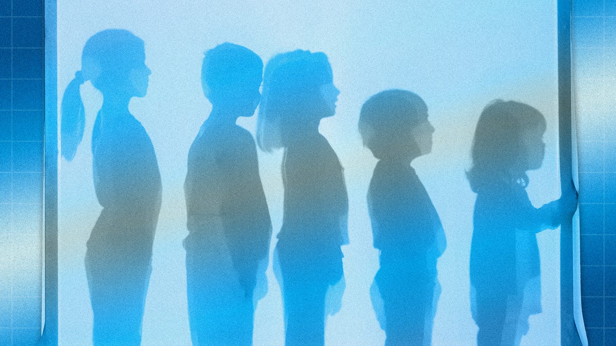 image of children behind a blue screen