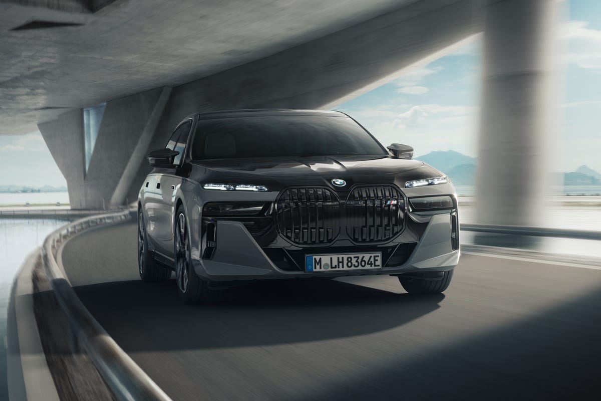 BMW M760e Plug-In Hybrid Sedan driving toward the camera