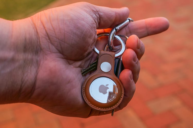 Apple AirTag in hand