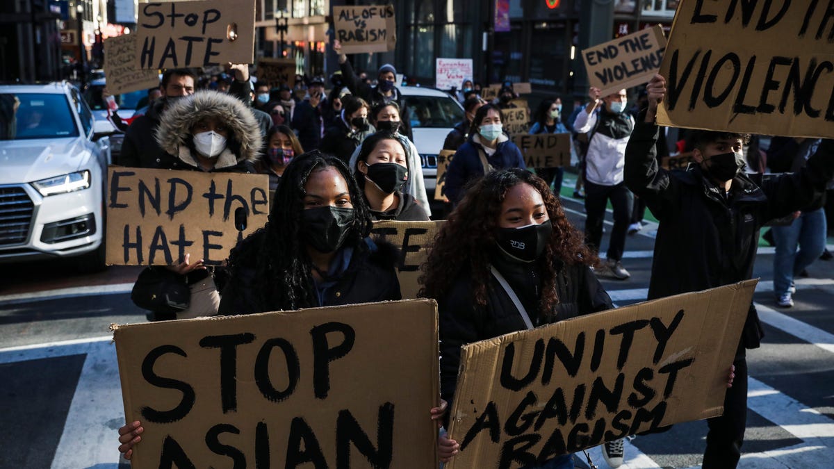 People march through Chinatown in Boston during a Stop Asian Hate rally.