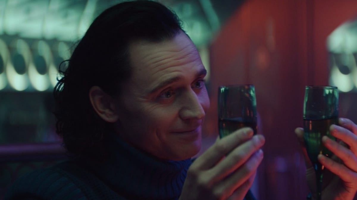 Loki with two drinks