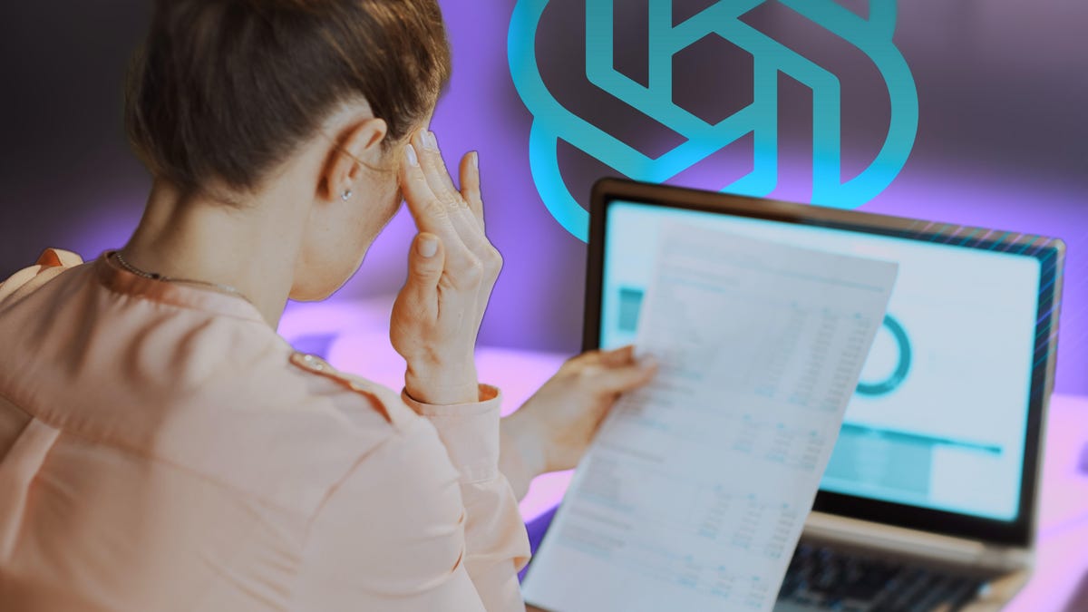 Women sitting in front of a laptop looking at a document