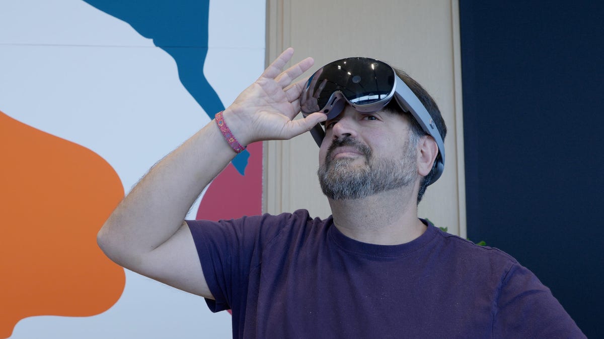 Samsung Galaxy XR headset on the face of CNET's Scott Stein