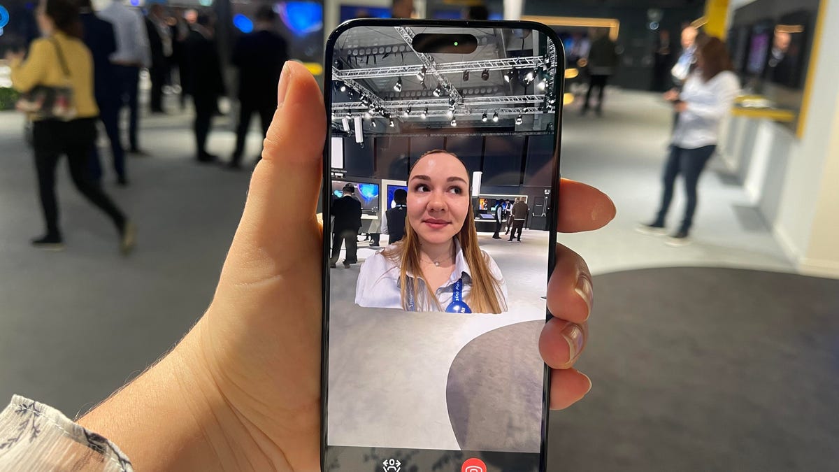 Phone screen showing hologram woman
