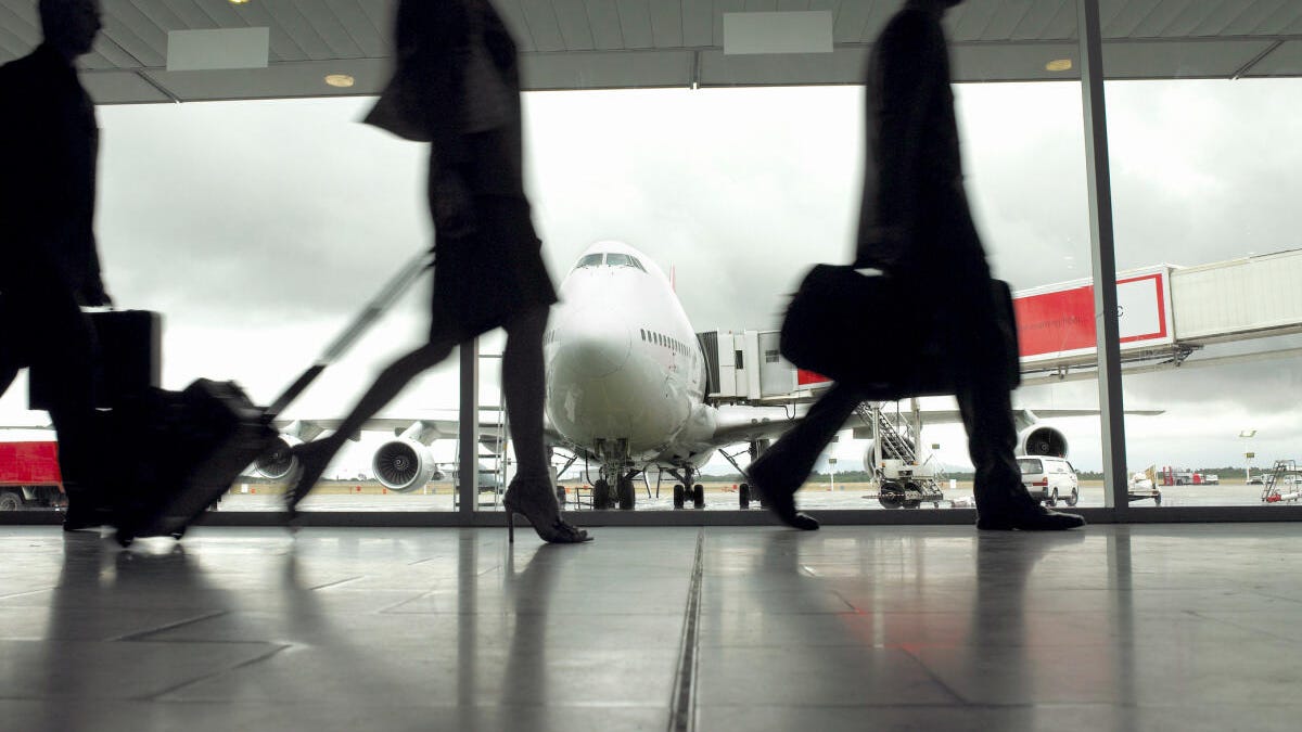 People walking with luggage in an airport