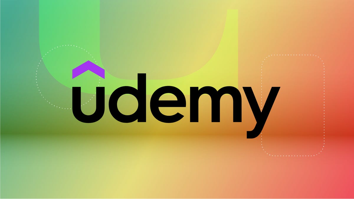 Udemy logo with purple accent on the U against red, yellow and orange-red CNET background.