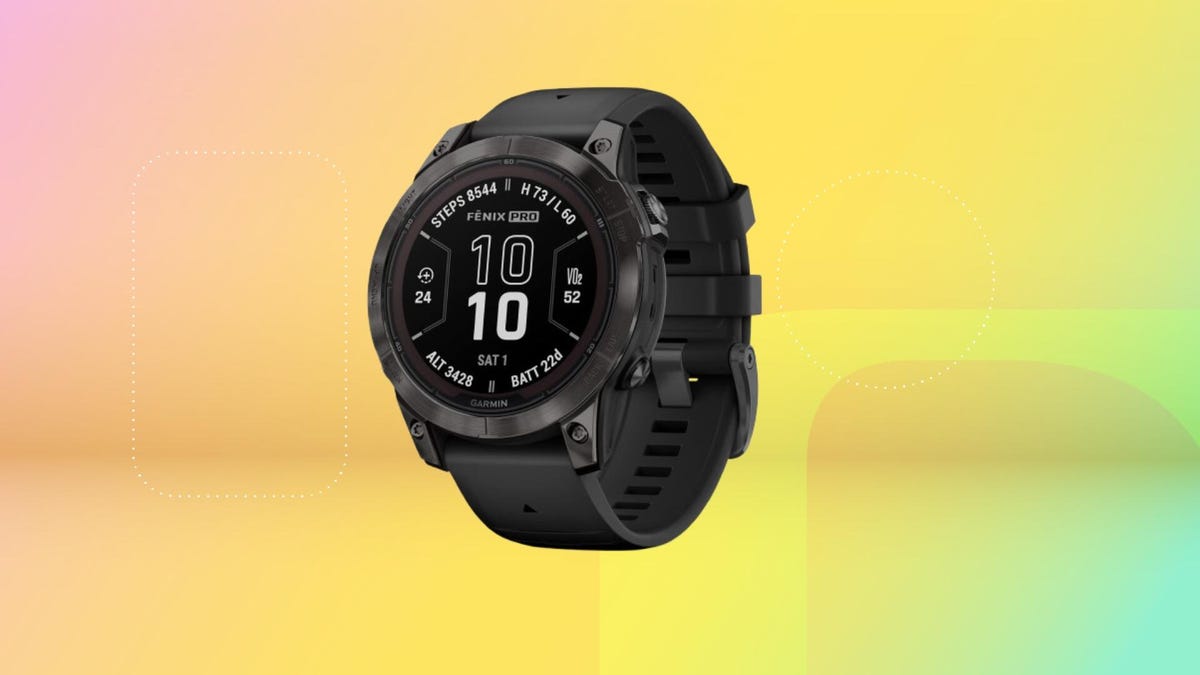 Garmin Fenix 7 Pro Sapphire solar smartwatch in black on a yellow background.