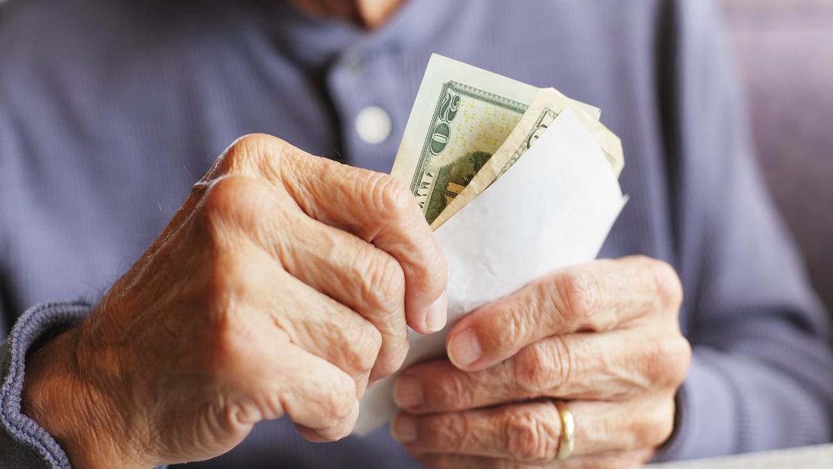 senior holding money