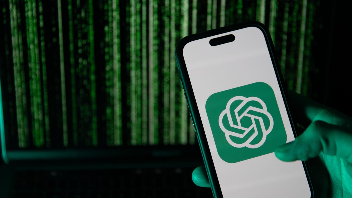 Phone displaying ChatGPT logo in front of screen