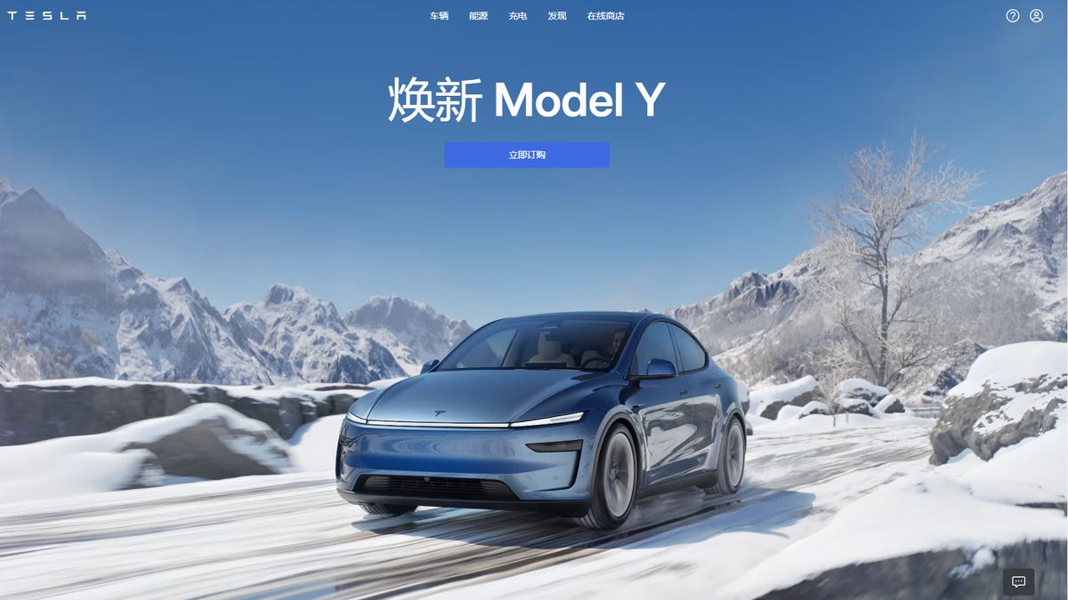 Tesla Model Y driving across a snowy landscape