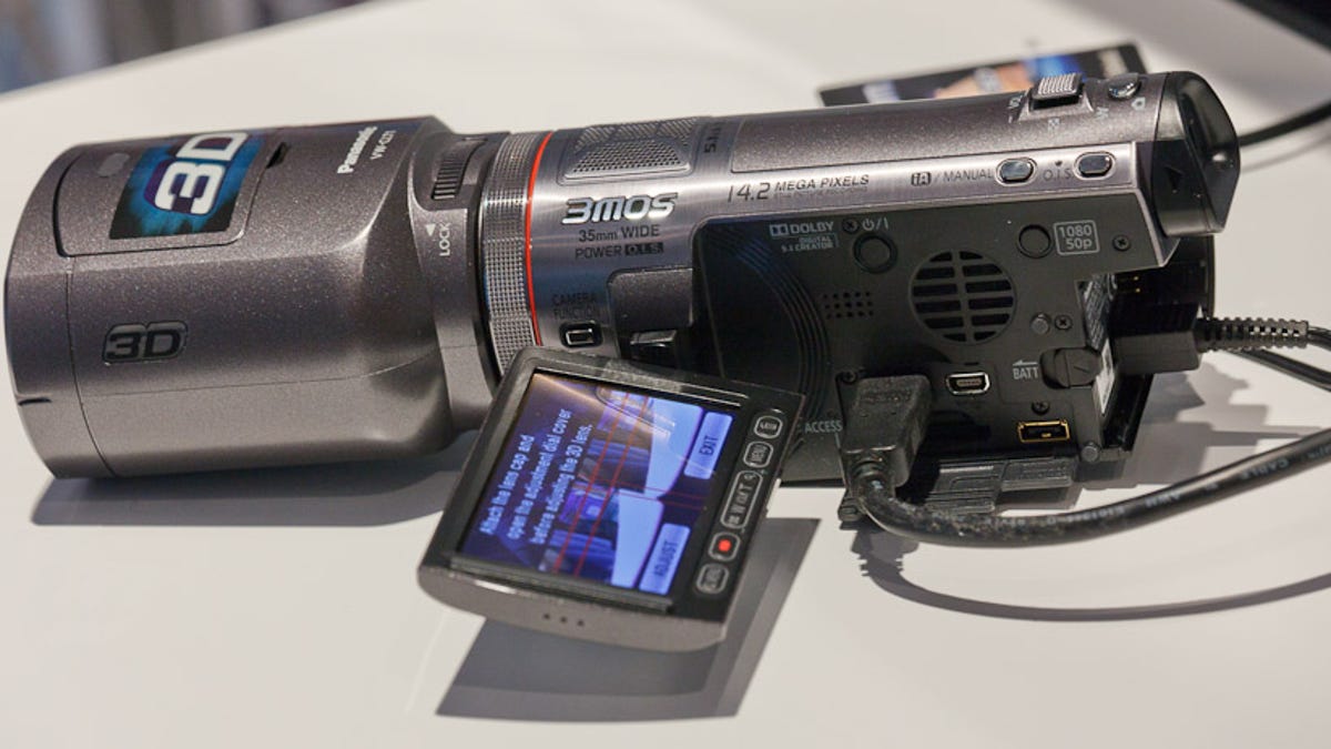 Panasonic's 3D-capable camcorder, shown here with its detachable 3D lens module, can show dual images on its screen.