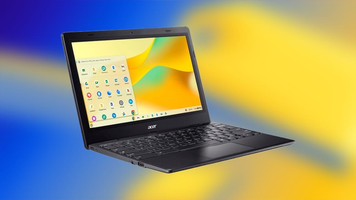 An Acer Chromebook 311 against a blurred blue and yellow background