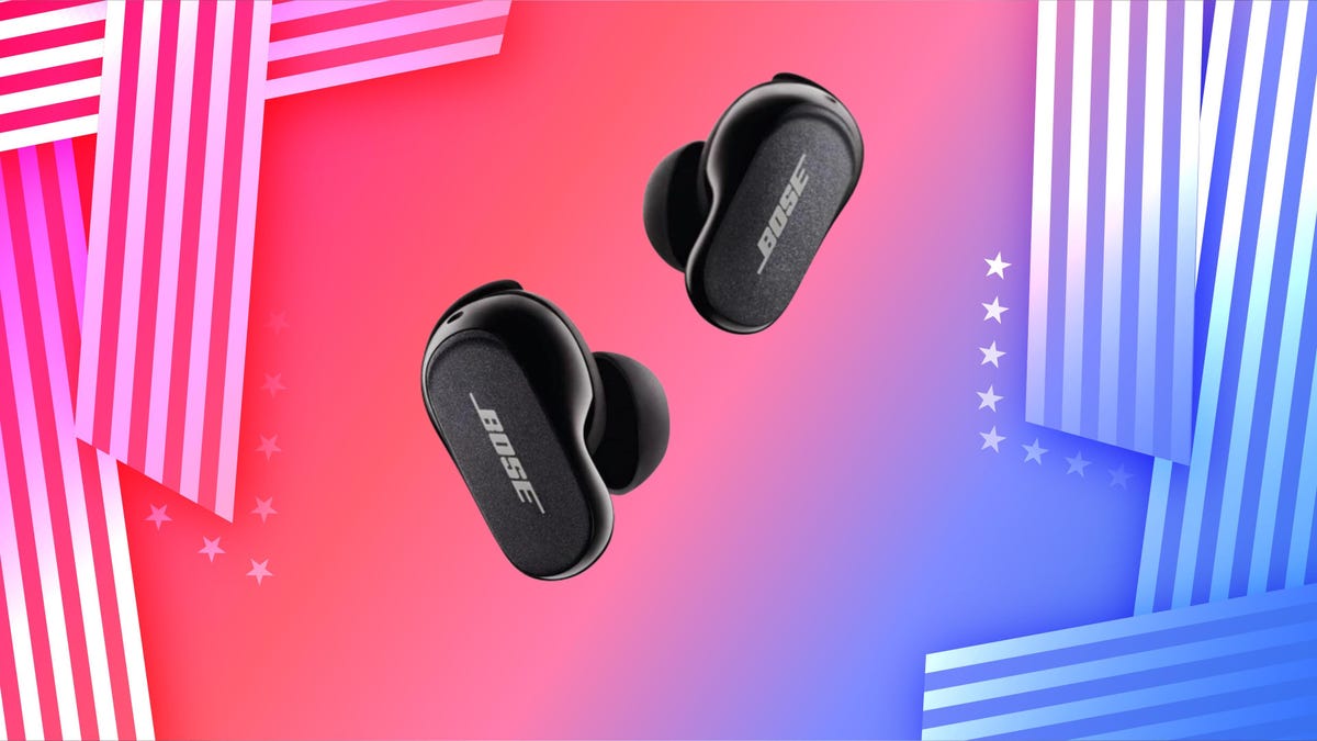 Bose QuietComfort II in Soapstone on a green gradient background