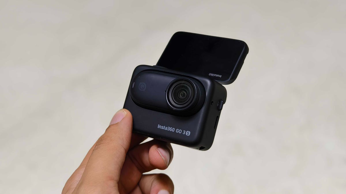 Prakhar Khanna holding the Insta360 Go 3s Action Pod with camera inside it.