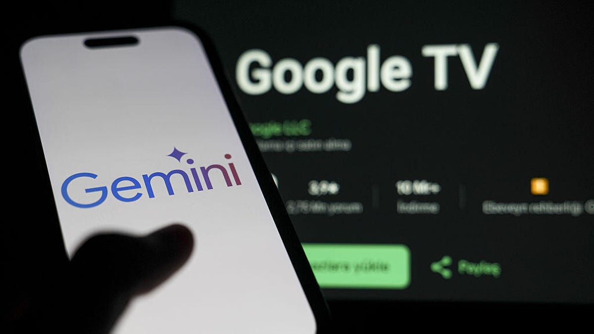 Gemini logo on smartphone, Google TV in the background