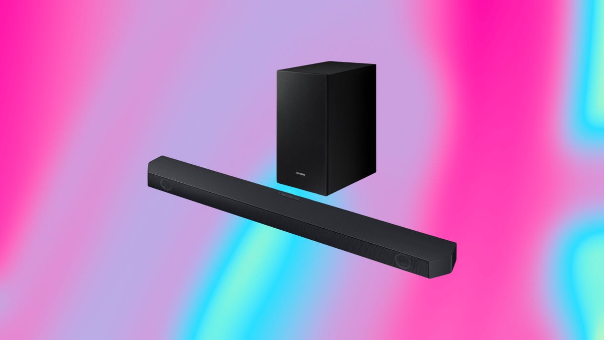 The Samsung Q-series Dolby Atmos soundbar is displayed against a pink and blue background.