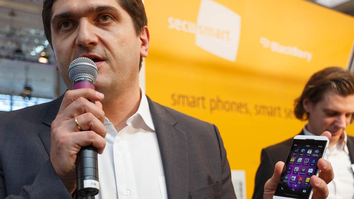 Sinisha Patkovic, vice president of BlackBerry's security advisory service, holds a secured BlackBerry Z10 phone at the CeBit show.