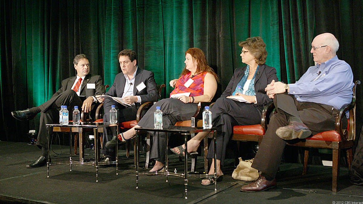 Luigi Gambardella, chairman of the European Telecommunications Network Operators, second from left, says his members want to to be paid by content providers based on "the value of the information" being transmitted, such as part of the cost of an online movie rental.
