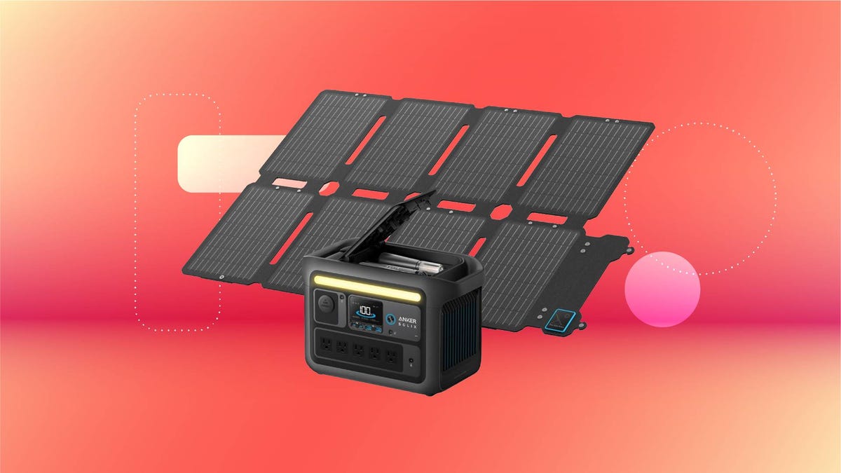 A gray power station and solar panel against a red gradient CNET background.