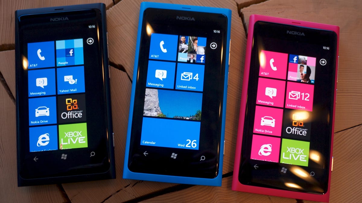 The Nokia Lumia 800 in black, cyan, and magenta.