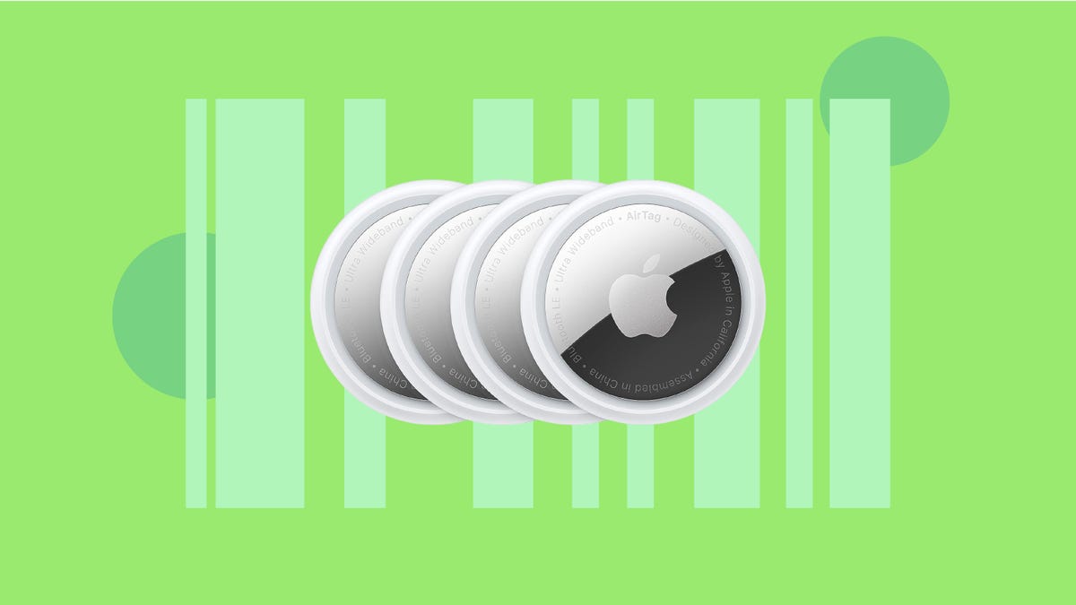 Four Apple AirTags are displayed against a green background.