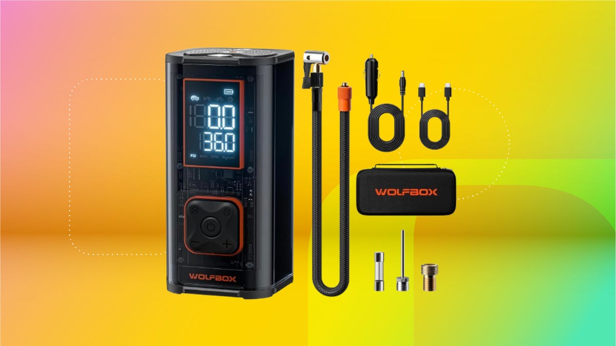 Black tire air compressor kit with cables and pouch against coral, yellow and mint green CNET background.