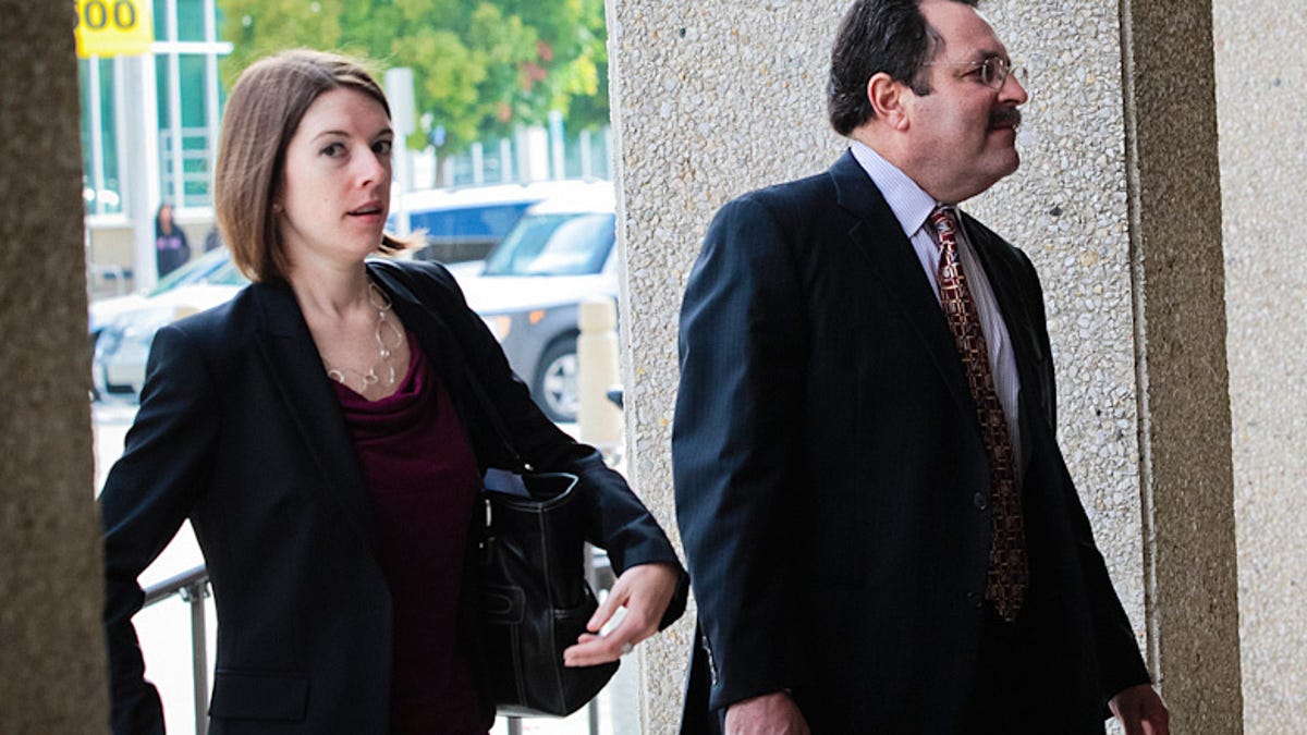 Claudia Quiroz and Jeff Bornstein, attorneys for a man facing criminal charges relating to an iPhone prototype, enter a San Mateo county courthouse today.