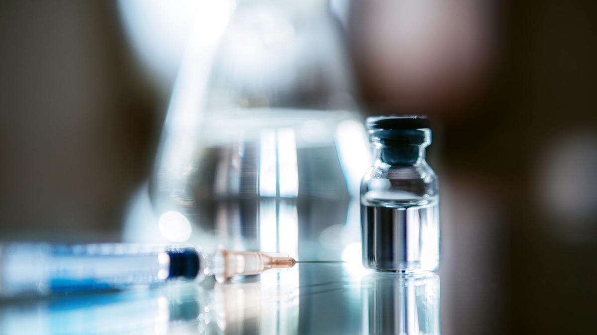 A vial of insulin and needle