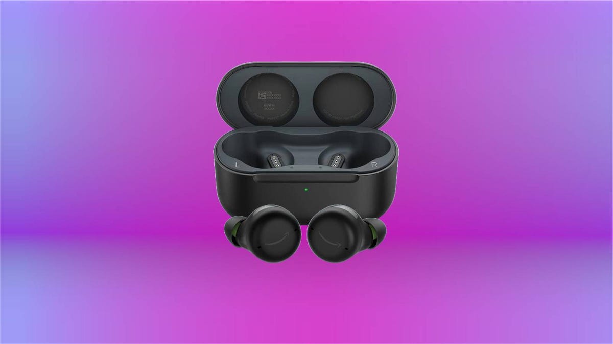 A pair of black earbuds with the charging case against a purple background.